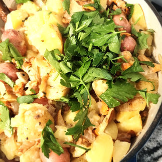 potatoes and mushrooms garnished with a parsley