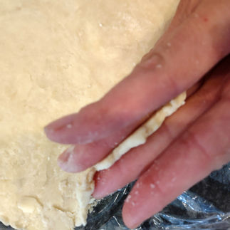 finger showing the thickness of the dough