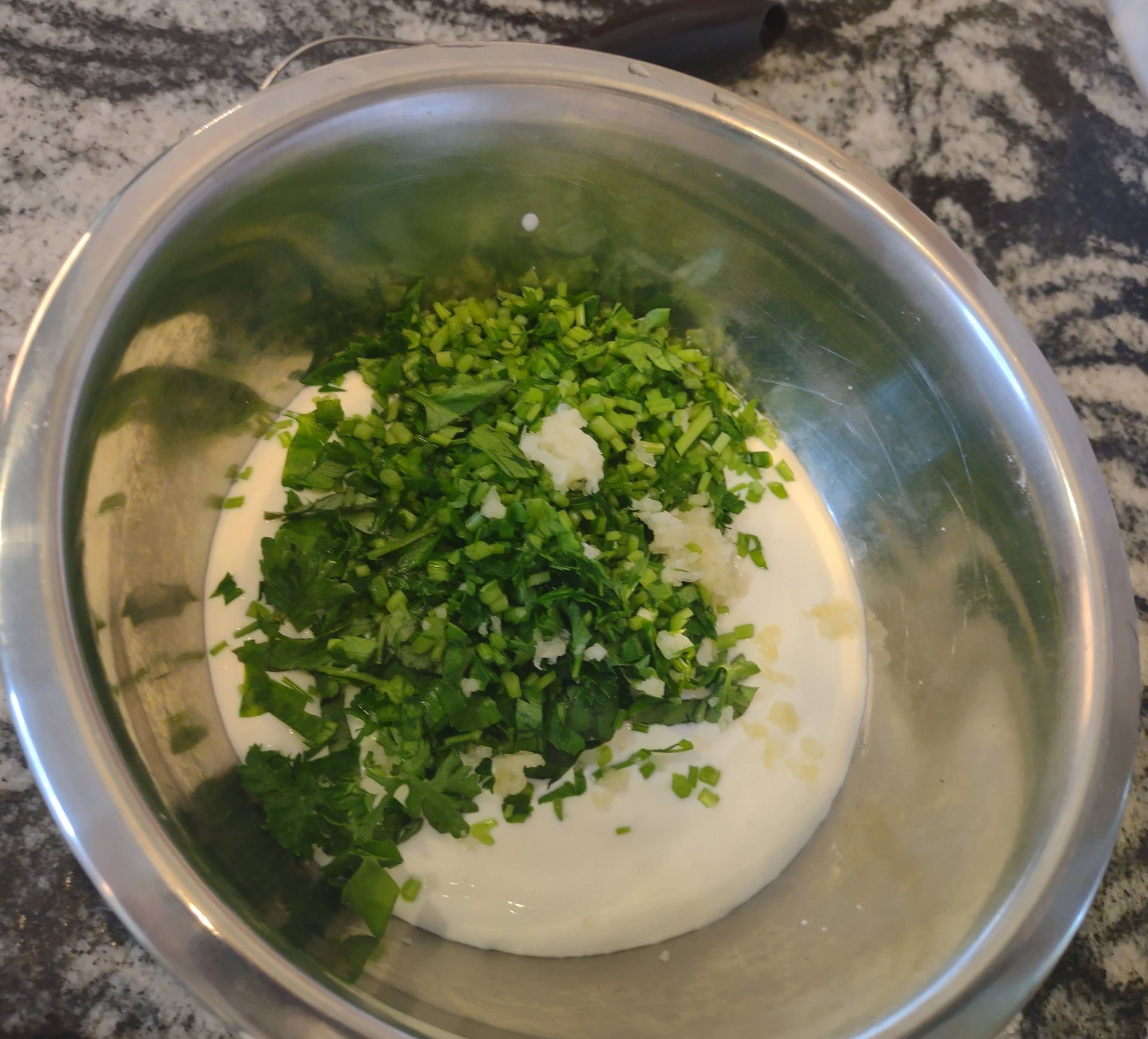 cream fraiche and herbs in a bowl
