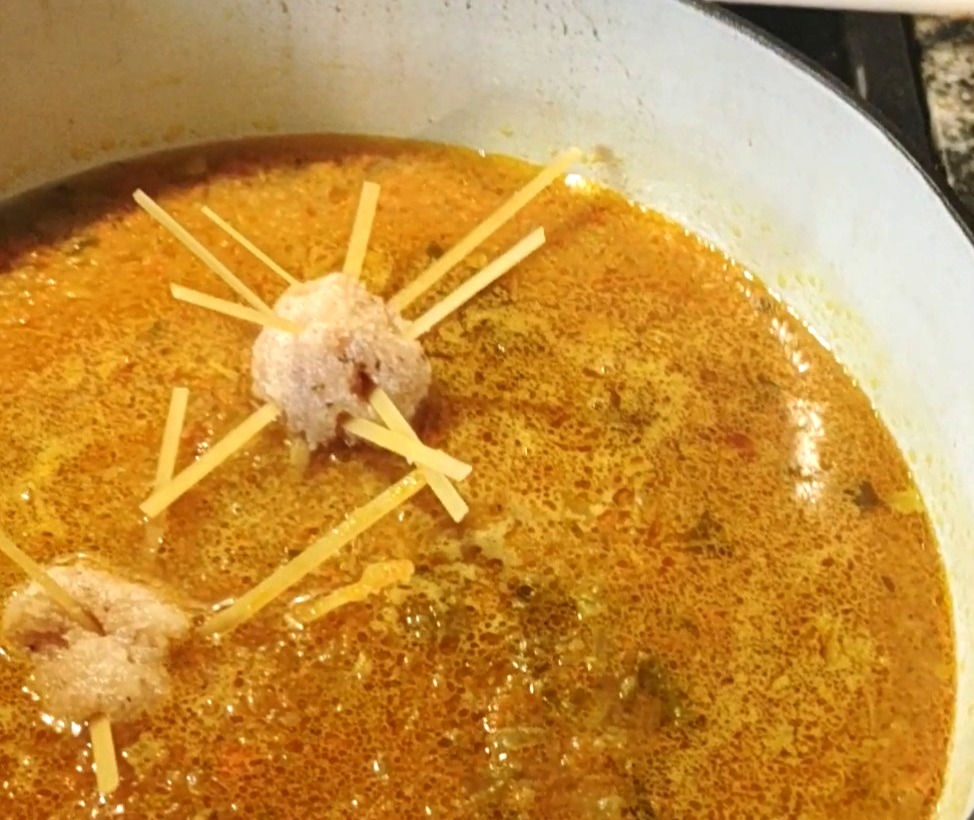 pot of soup with a chicken meatballs