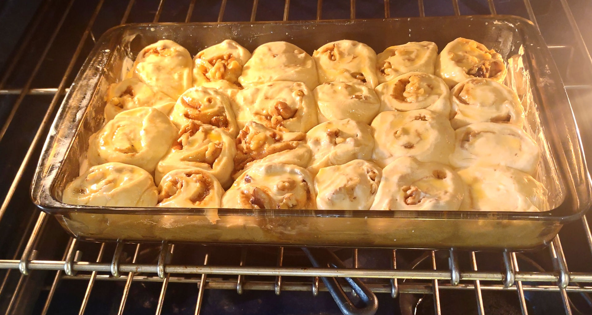 cinnamon rolls pan in an oven