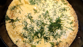 Ukrainian omelet with farmer’s cheese and fresh dill served on a plate