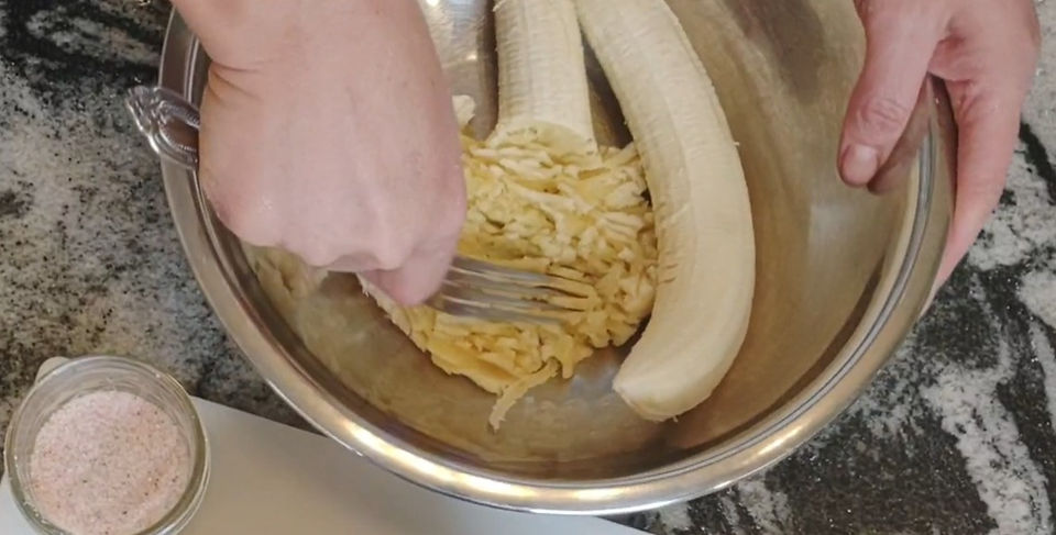 fork using to smash bananas