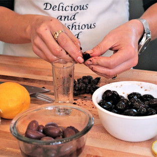 pitting olives by hand