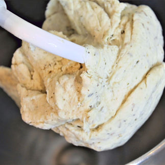 dough in the bowl with  hook attachment