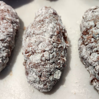 meat petties rolled into the flour, uncooked
