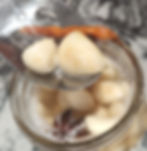 jar with fermented garlic, spoon