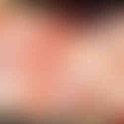 casserol dish with red sauce and cheese topped before oven