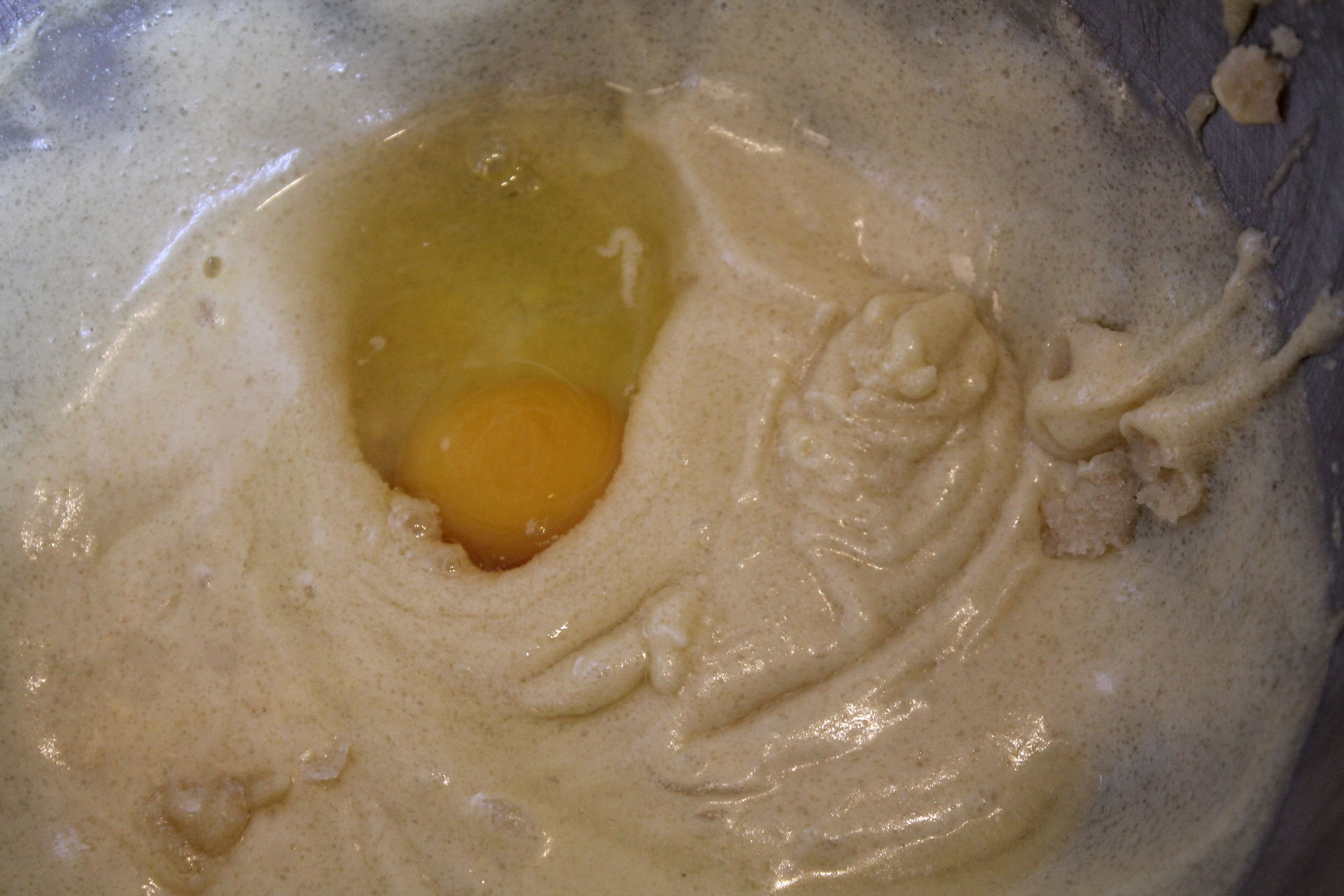 mixing bowl with dough and one egg