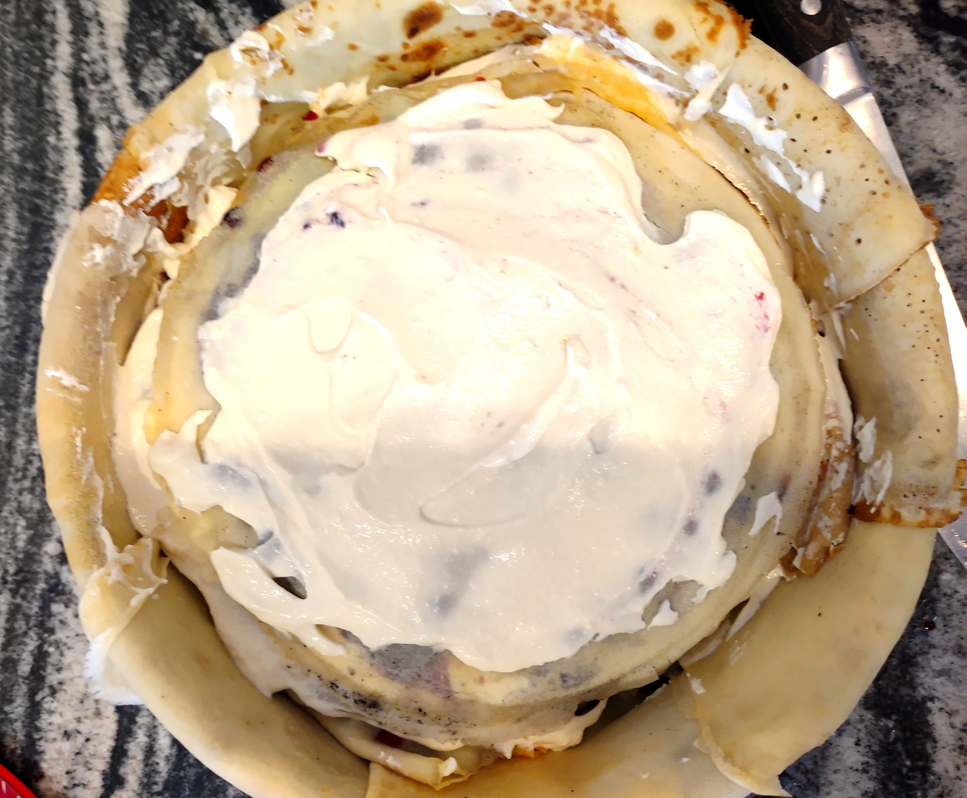 crepe cake in a process of layering