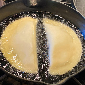 frying in an oil two pies in a cast iron pan 
