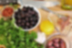 black olives, anchovies, red pepper flax, lemon, garlic, parsley, and Kalamata olives