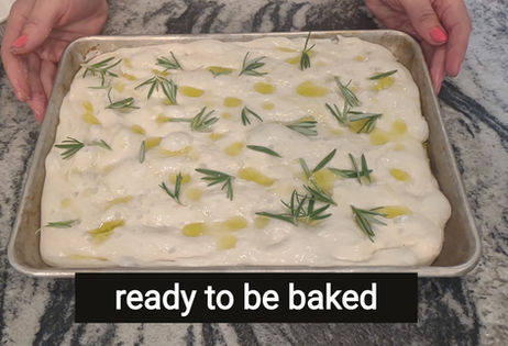 unbaked focaccia on a baking sheet