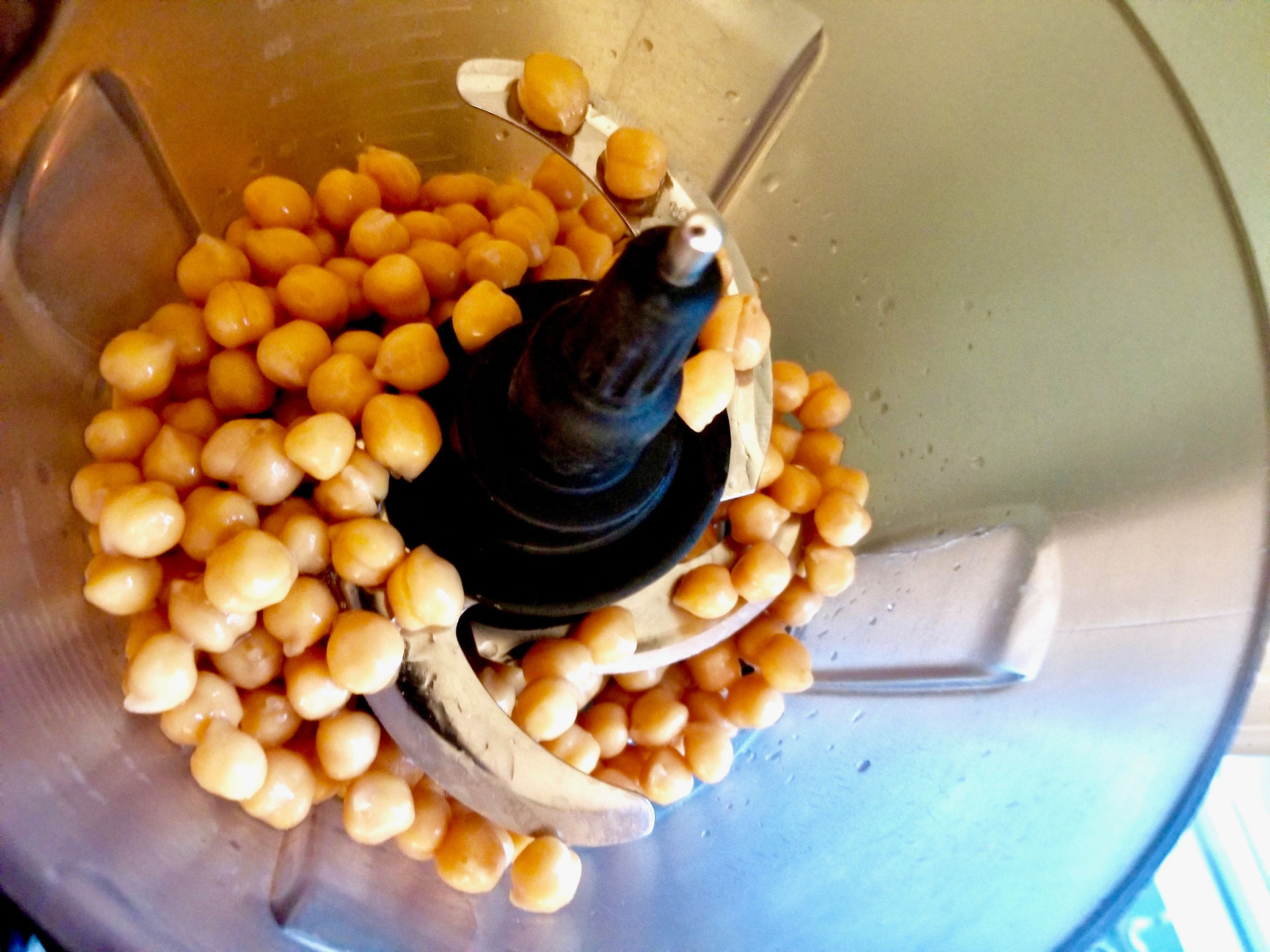 Close-up of whole chickpeas in a blender