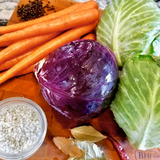 Ingredients for sauerkraut: cabbage, carrots, peppercorn, salt, bay leaves, chili pepper