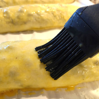 brushing rolls with egg wash