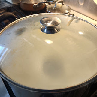 covering with lid pot of milk