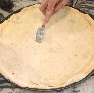 poking with a fork pizza crust