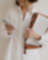 Woman on phone with laptop.png