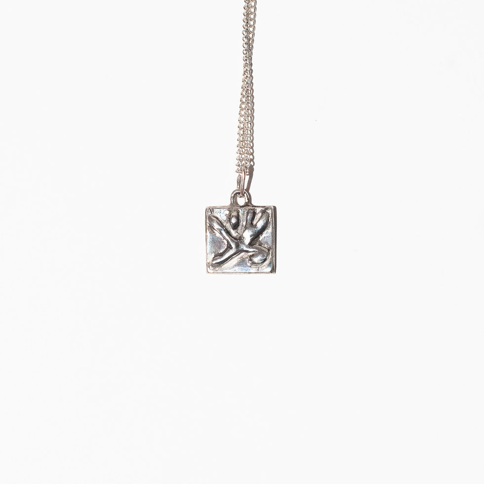 Thumbnail: Silver square pendant hanging against a white background