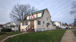 Siding and new metal roof on Akron, Ohio home.