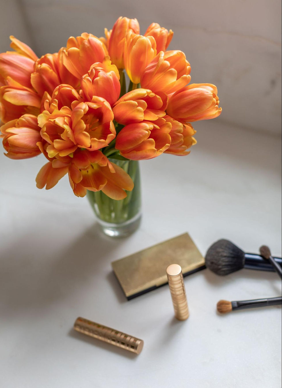 Orange tulips and makeup. Interior Design & Styling: RCL Interiors | Photo: Jessie Preza