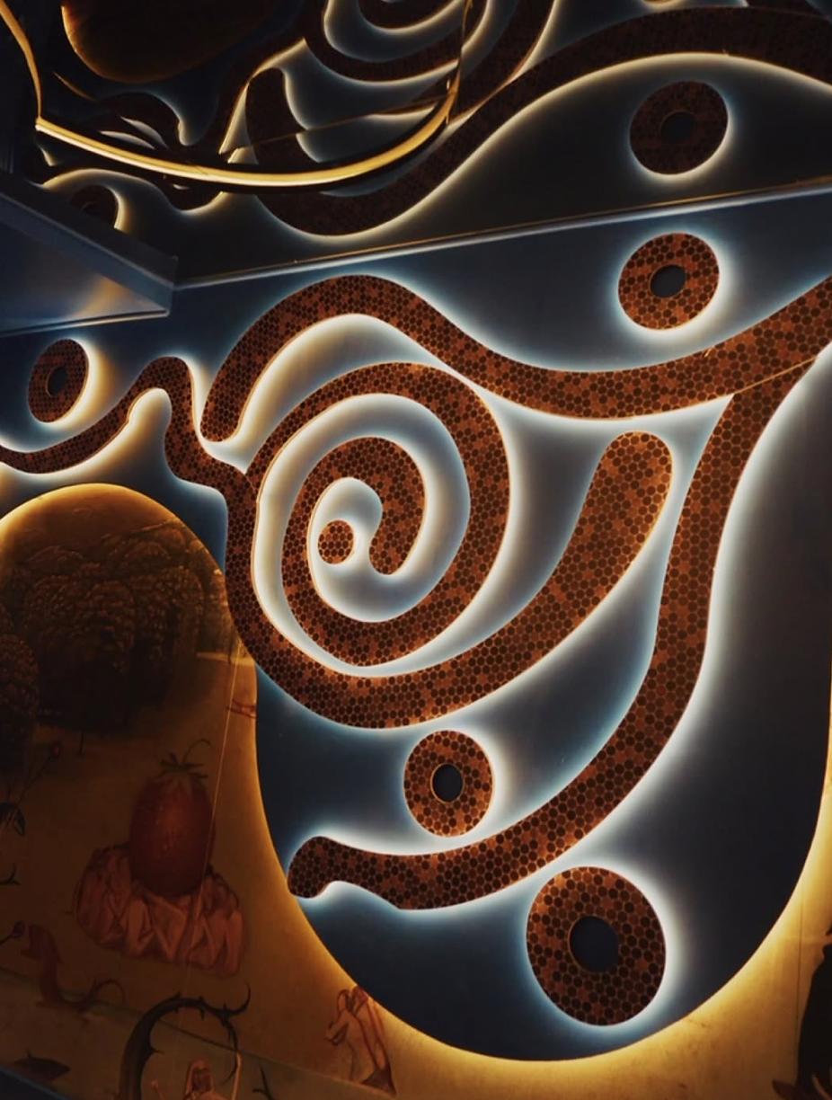 Illuminated swirling metallic wall art