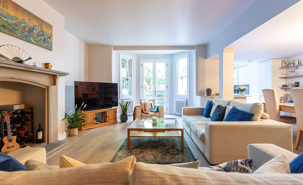 luxurious lounge in comfortable neutrals with accents of blue and wooden floor