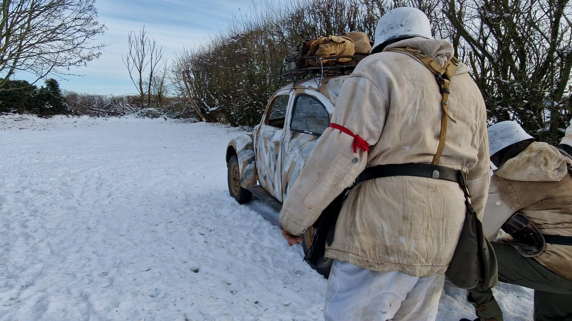 Kubelwagen snow walk past and VW Beetle