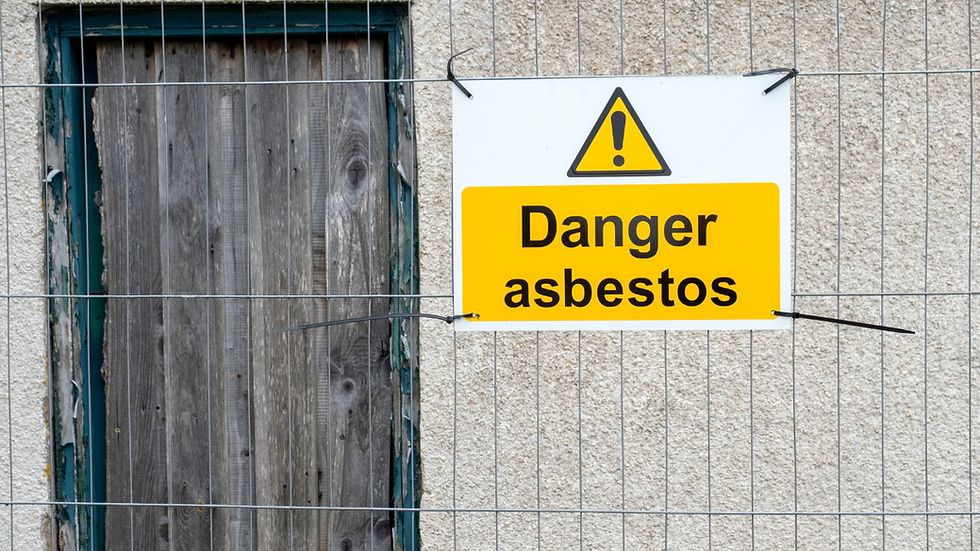 A danger sign warning asbestos, on a railing