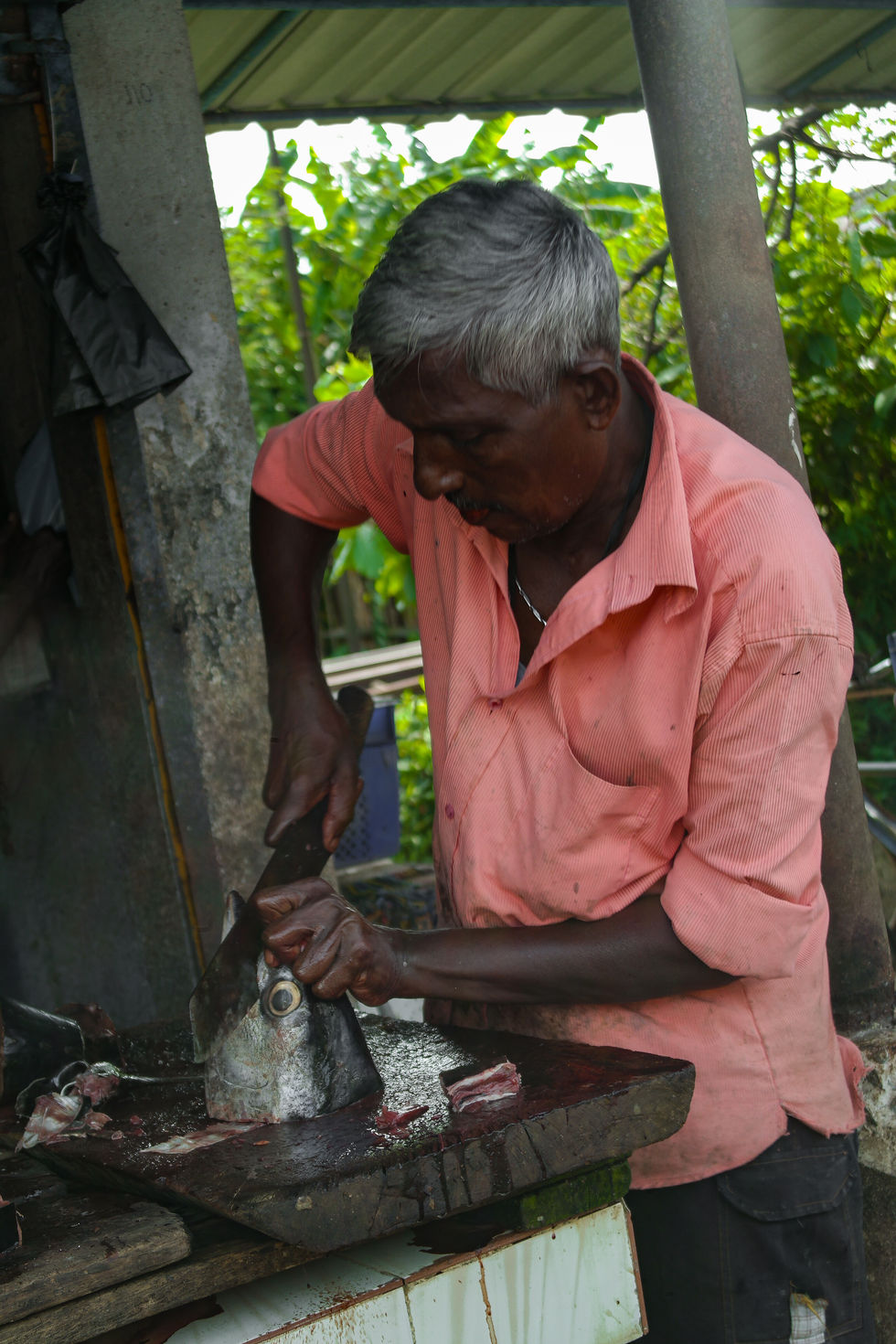 man selling fish in the streets of Weligama, Sri Lanka