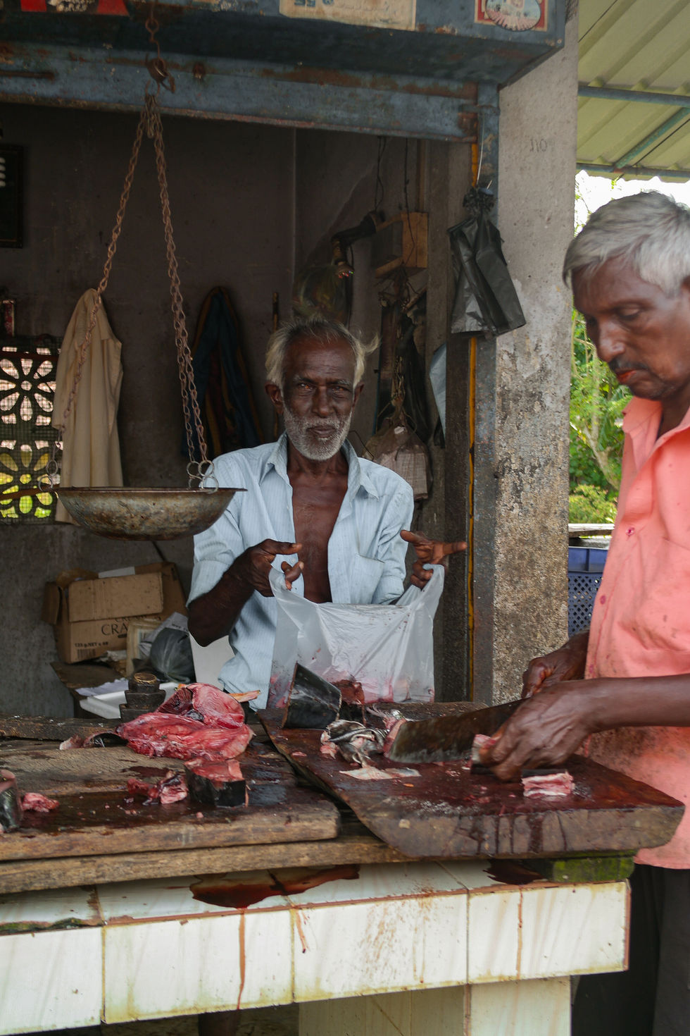 man selling fish in the street of Weligama, Sri Lanka