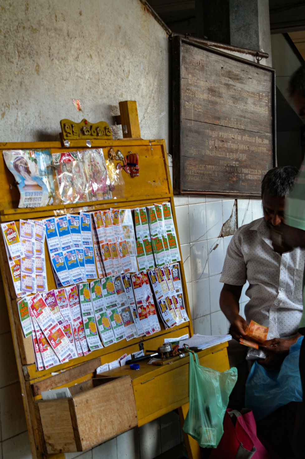 man selling lottery tickets in Sri Lanka