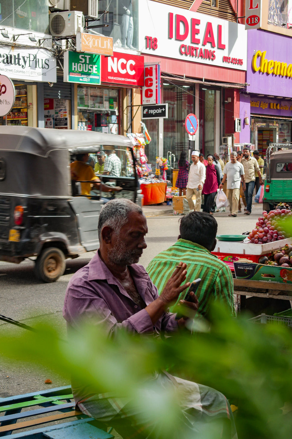 man looking at his phone in Colombo, Sri Lanka