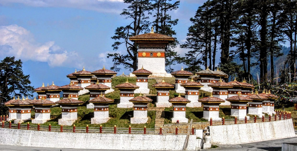 The 108 stupas at Dochu La Pass mirror the snowy mountain vistas seen from the pass