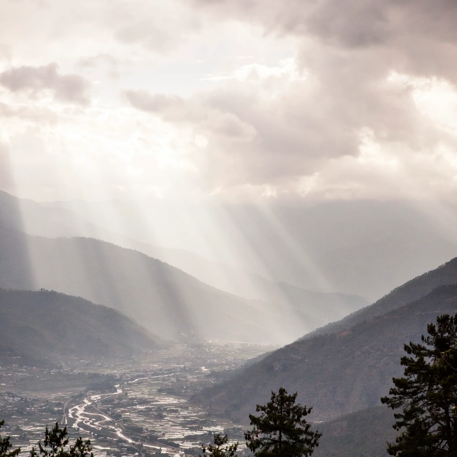 Dramatic sunrays light up the Paro Valley
