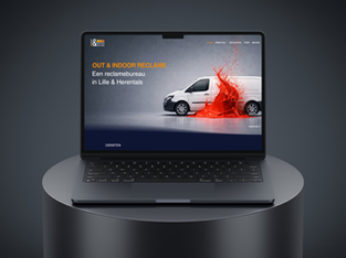 etail van de nieuwe website layout voor Out & Indoor Reclame Herentals, getoond op een laptop mockup.