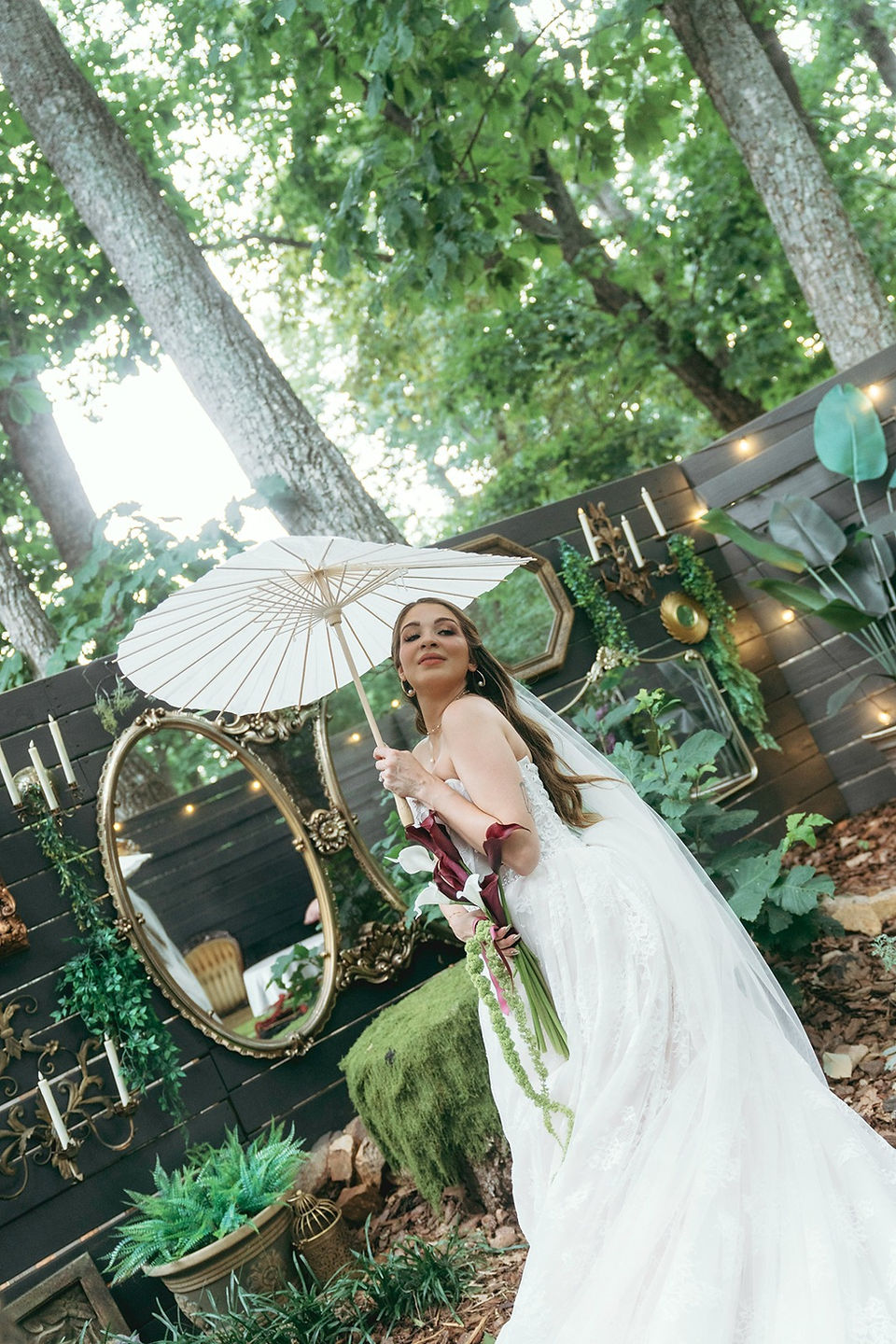 bride under umbrella at garden