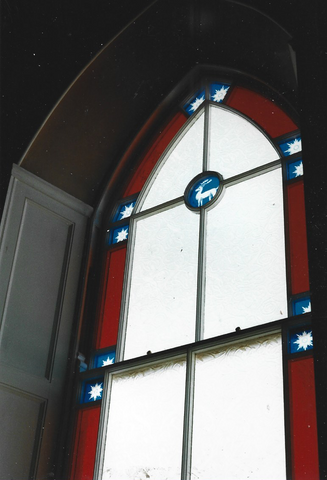 Inside view of the large stained glass window at White Hart Hall