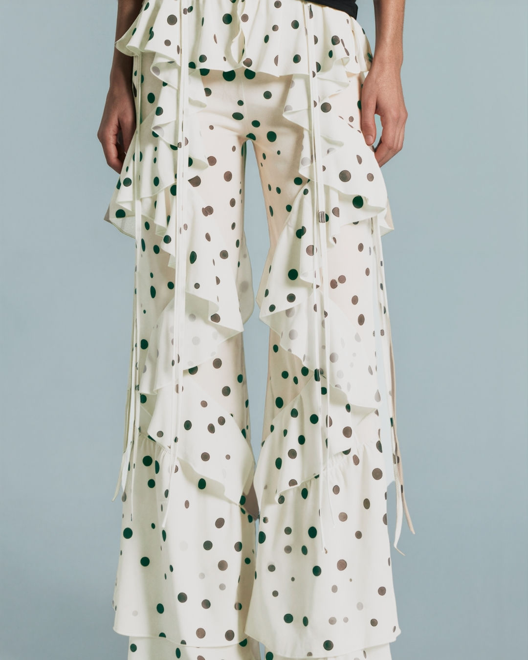 Detail view of the Dotty About You Ruffle Pants on model, showing ruffle legs, design and fit