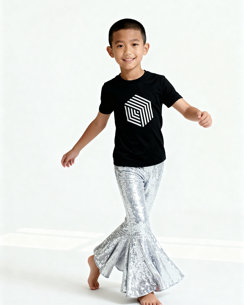 Thumbnail: Active pose of boy wearing silver sequin kids pants in studio showing flare