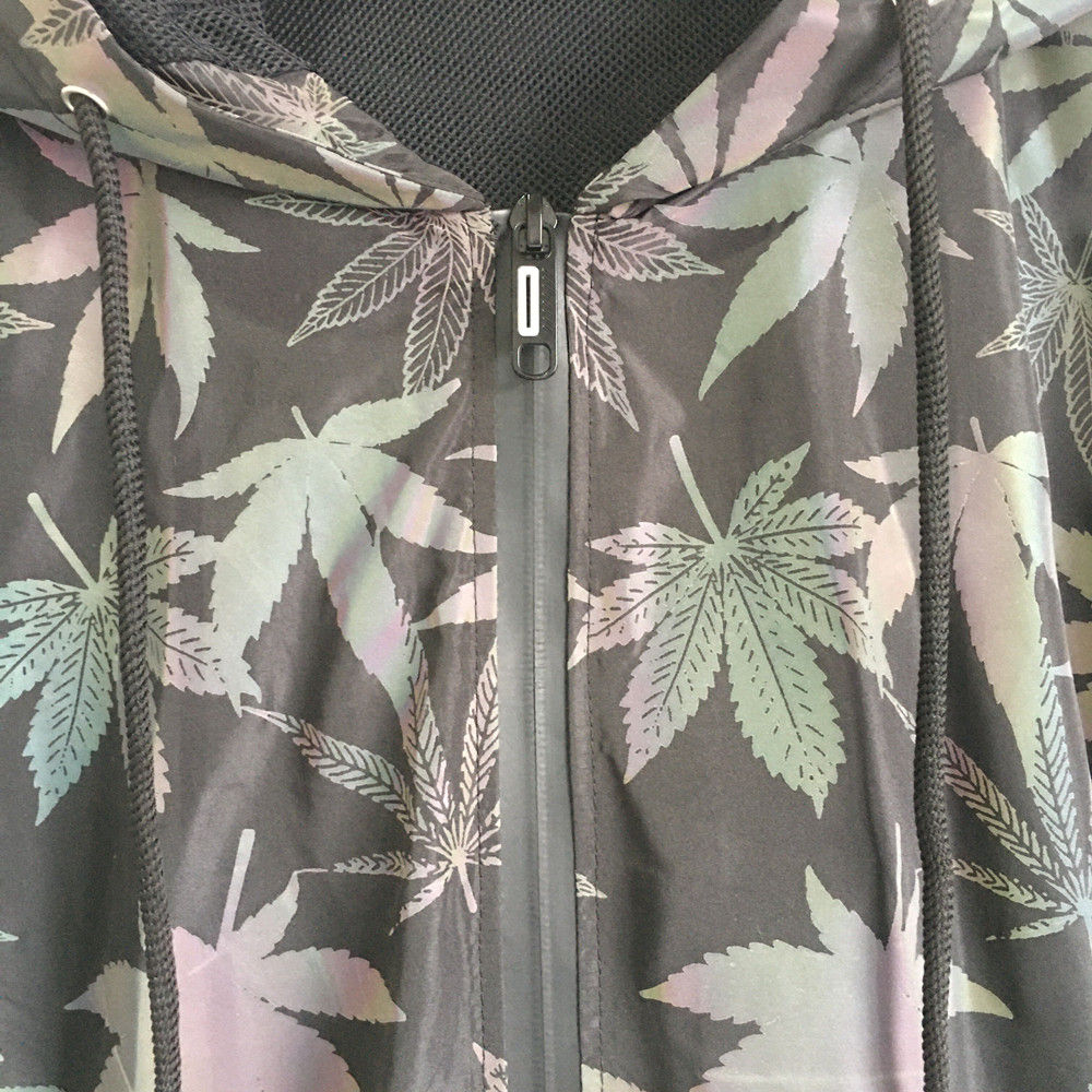 Close-up of gray jacket with leaf pattern and zipper; Chronic Wave Windbreaker.