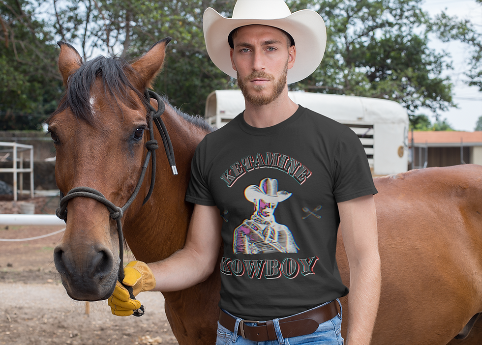 Thumbnail: Front view of cowboy model wearing Ketamine Kowboy graphic streetwear tshirt in outdoor setting