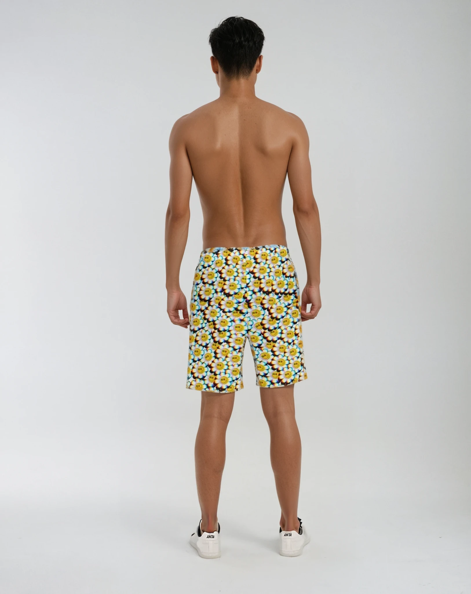 Back view of the Crazy Daisy Beach Shorts on model, showing design and fit