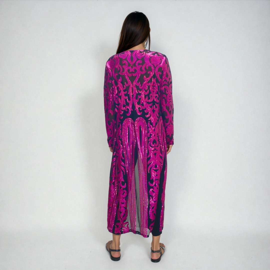Back view of holographic pink sequin kimono on model in studio showing baroque sequin pattern on mesh
