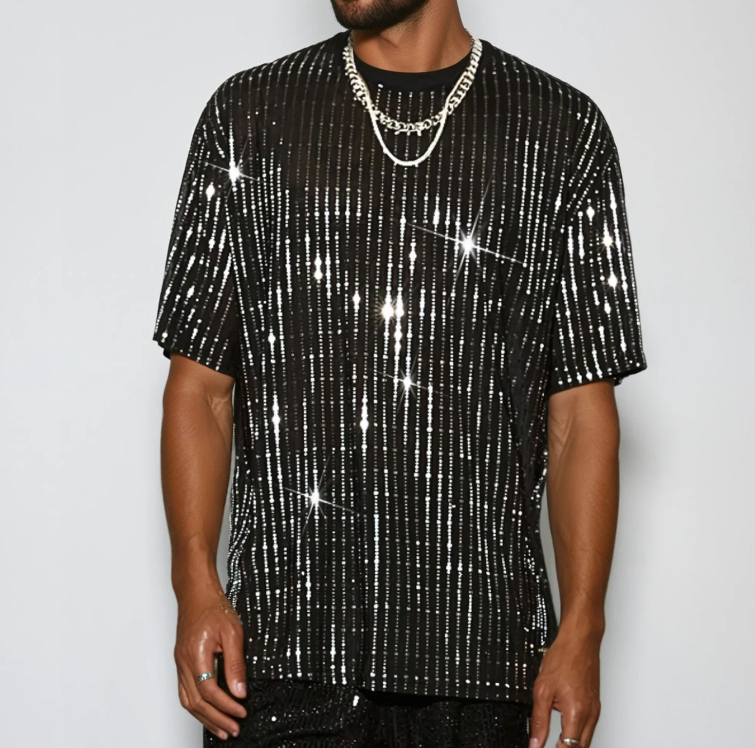 Front view of the black mesh t-shirt with silver foil sparkle on model in studio