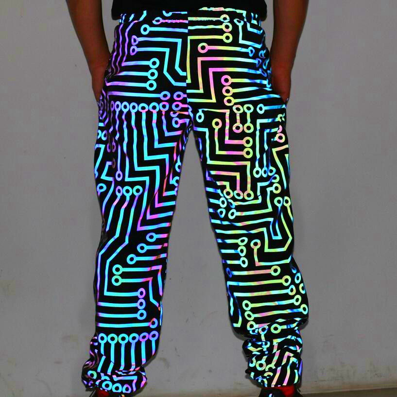 Thumbnail: Back view of the Circuit Breaker reflective joggers on male model under flash lighting conditions