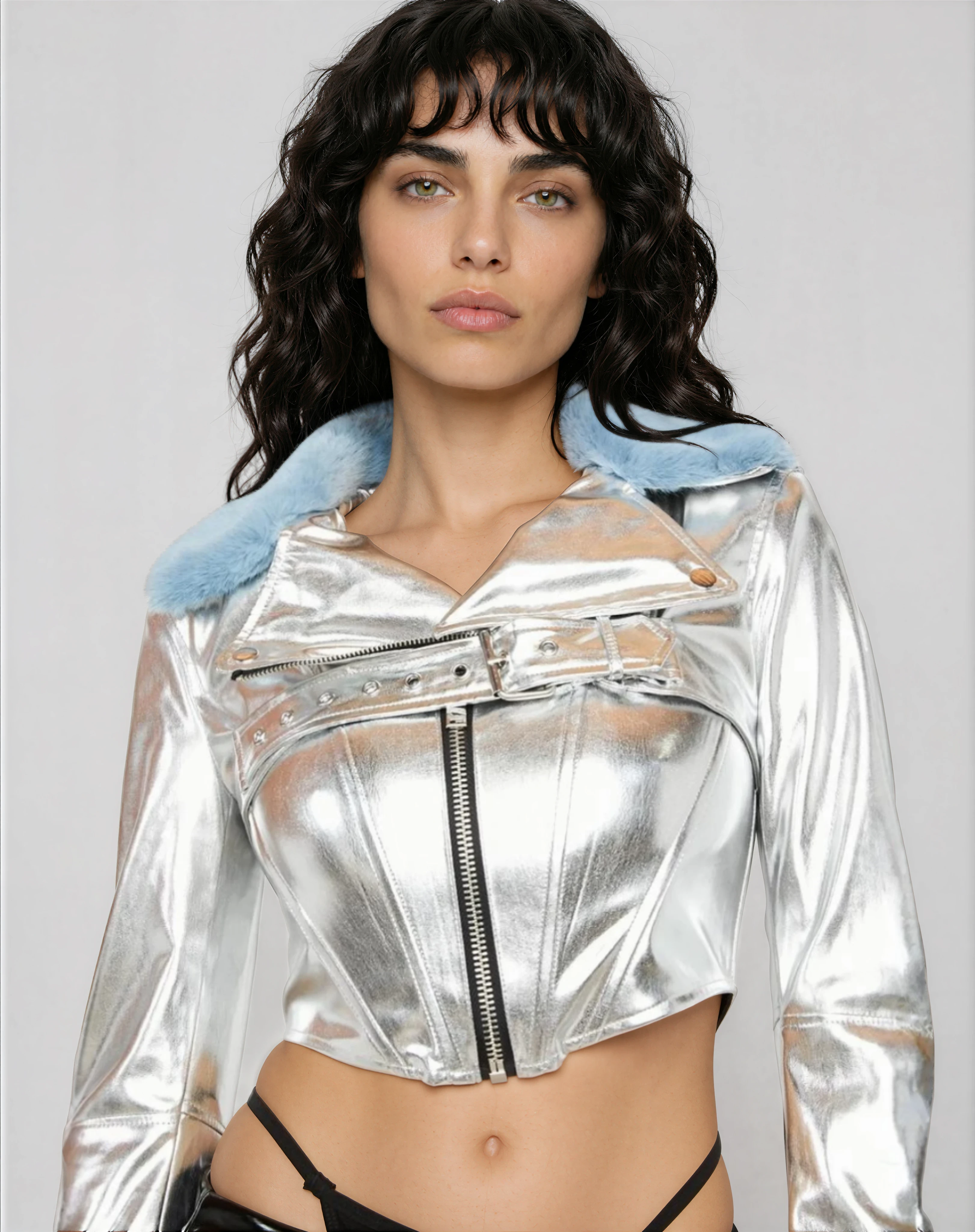 Front view of silver moto jacket on model in studio showing faux fur collar design