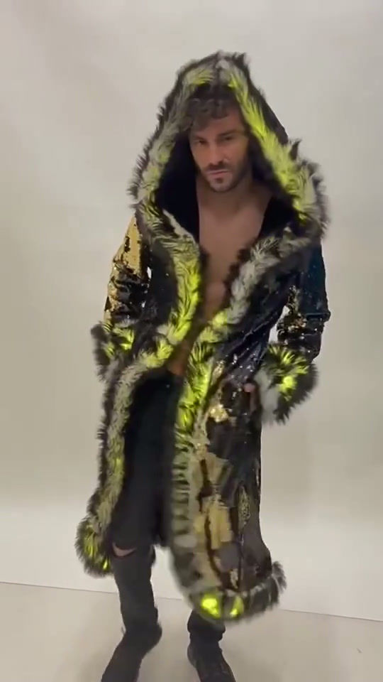 Thumbnail: Video of the Ultimate Festival Coat worn by model in studio, showing programable LED lighting