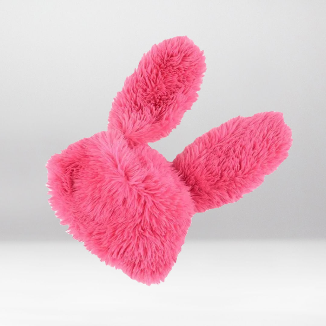 Isolated view of pink rabbit ear fuzzy rave hat show furry fabric and long floppy ears